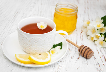 Cup of tea with jasmine flowers