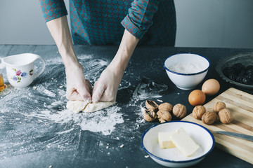 table with cookie cutter flour and various ingredients