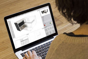 woman computer modelling a house