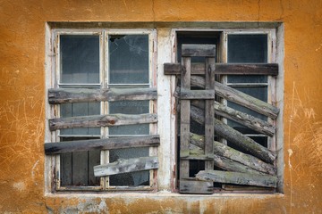 two old boarded-up window on the wall - 96082098