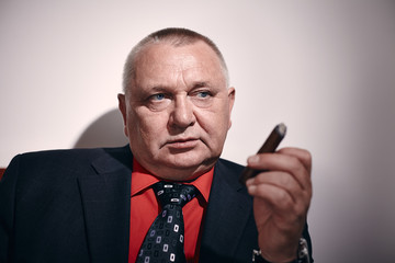 Man with cigar closeup