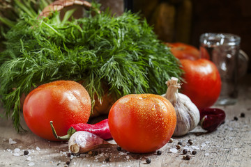 Preparing for canning tomatoes: dill, garlic, pepper and spices