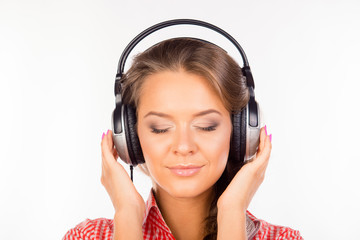 Fototapeta premium Calm relaxed young woman with headphones