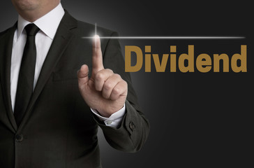 dividend touchscreen is operated by businessman concept
