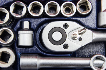 close up car engine with tools