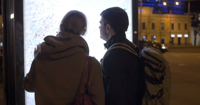 Tourists checking the pad route with street map
