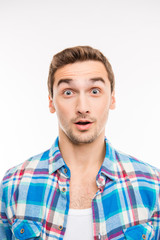 Obraz premium Photo of a surprised handsome young man