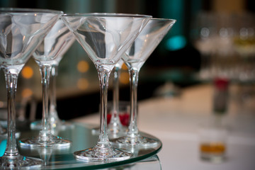 A row of empty martini glasses