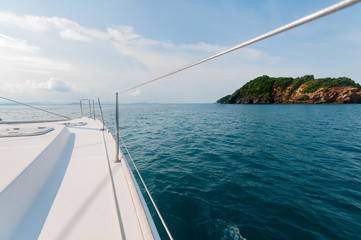Catamaran yacht sailing towards the island ahead in Phuket, Thai
