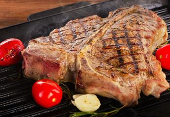 Grilled steak on grill pan.