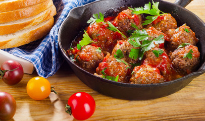 Homemade Meatballs with  Sauce and herbs.
