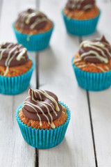 five cupcakes in blue glands