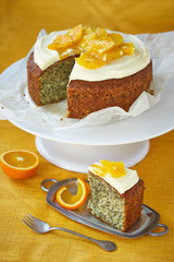 a sponge cake with poppy seeds, oranges and cream