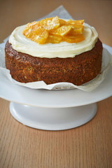 a sponge cake with poppy seeds, oranges and cream