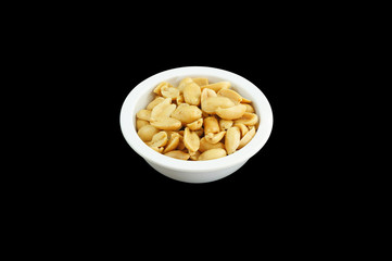 Salted peanuts, isolated on black background