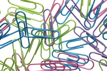 colored paperclips isolated on white.