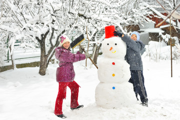 kids and snowman