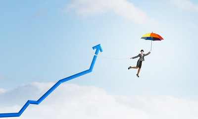 Woman flying on umbrella