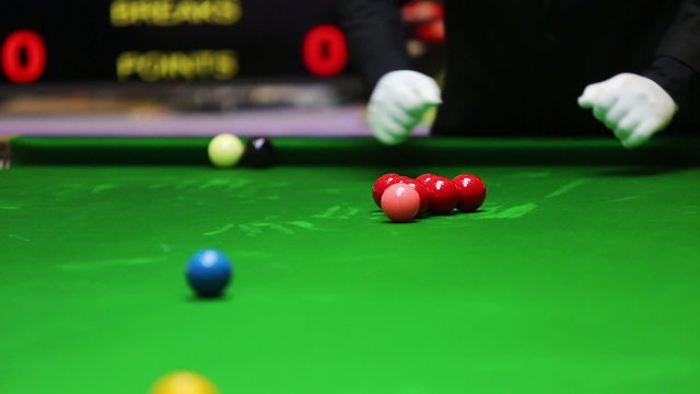 Snooker referee set up ball for new game
