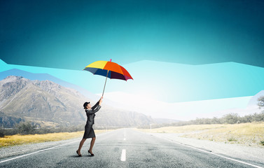 Woman flying on umbrella