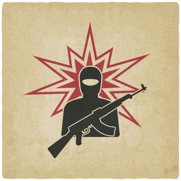 terrorist with gun old background