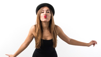 Woman with bowler hat sending a kiss
