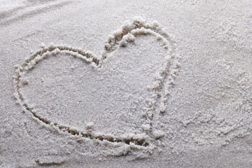 heart drawn in sand