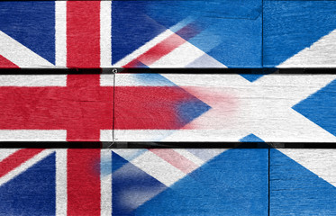 Fototapeta premium UK and scotland flag on wood background