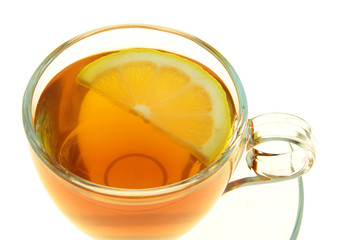 Tea in a glass cup with lemon slice 
