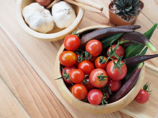 Tomato in wood bowl