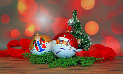 Christmas balls and branch on abstract background