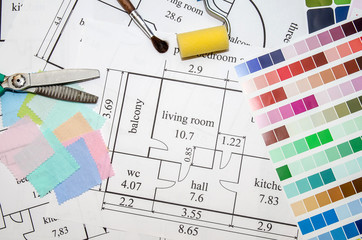 architectural plan of the house, color palette, furniture and fabric samples on wooden table