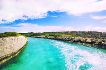 Ship track on the rever with clouds in the background