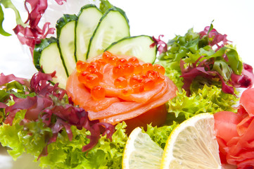 Japanese cuisine sashimi with vegetables and fish in a restaurant
