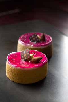 Raspberry pistachio tart topped with chocolate and almond