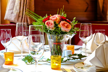 Cozy restaurant table with flowers