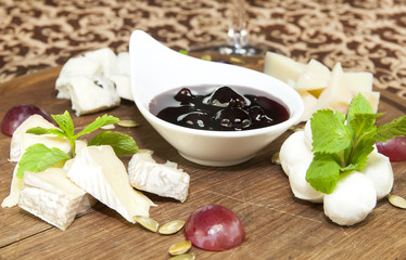 cheese plate with a large decorated the assortment of mint