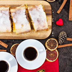 Strudel with custard and orange. Christmas Stollen. Christmas table decoration.