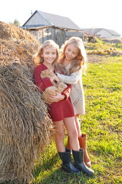 portrait of two sisters during the autumn harvest