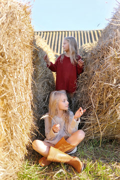 portrait of two sisters during the autumn harvest