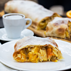 Strudel with custard and orange. Christmas Stollen. Christmas table decoration.