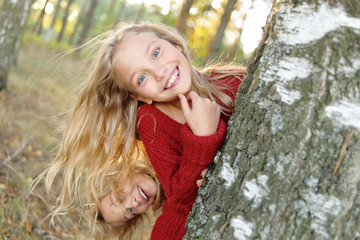 portrait of two sisters during the autumn harvest