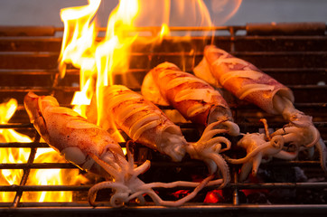  buttered fresh squid on flaming grill