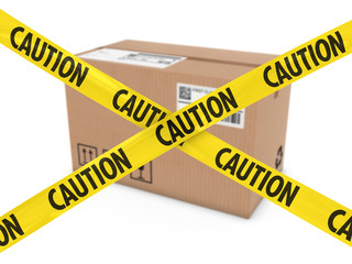 Suspicious Parcel Concept - Cardboard Box behind Caution Tape Cross