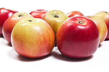 Group of ripe apples on a white background