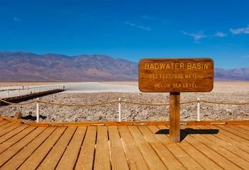 Foto auf Acrylglas Naturpark Sign Bad Water Basin and salt behind, Death Valley
