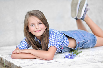 portrait of little girl outdoors in summer © zagorodnaya