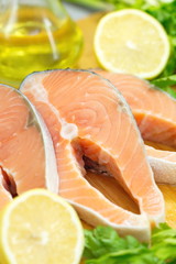 Raw fish with vegetables, lemon and oil prepared for cooking