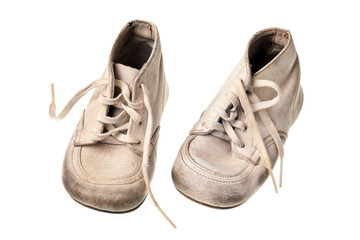 old baby shoes isolated on white background