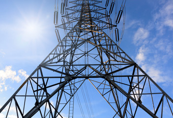 Electricity tower with sun light and beautiful blue sky backgrou